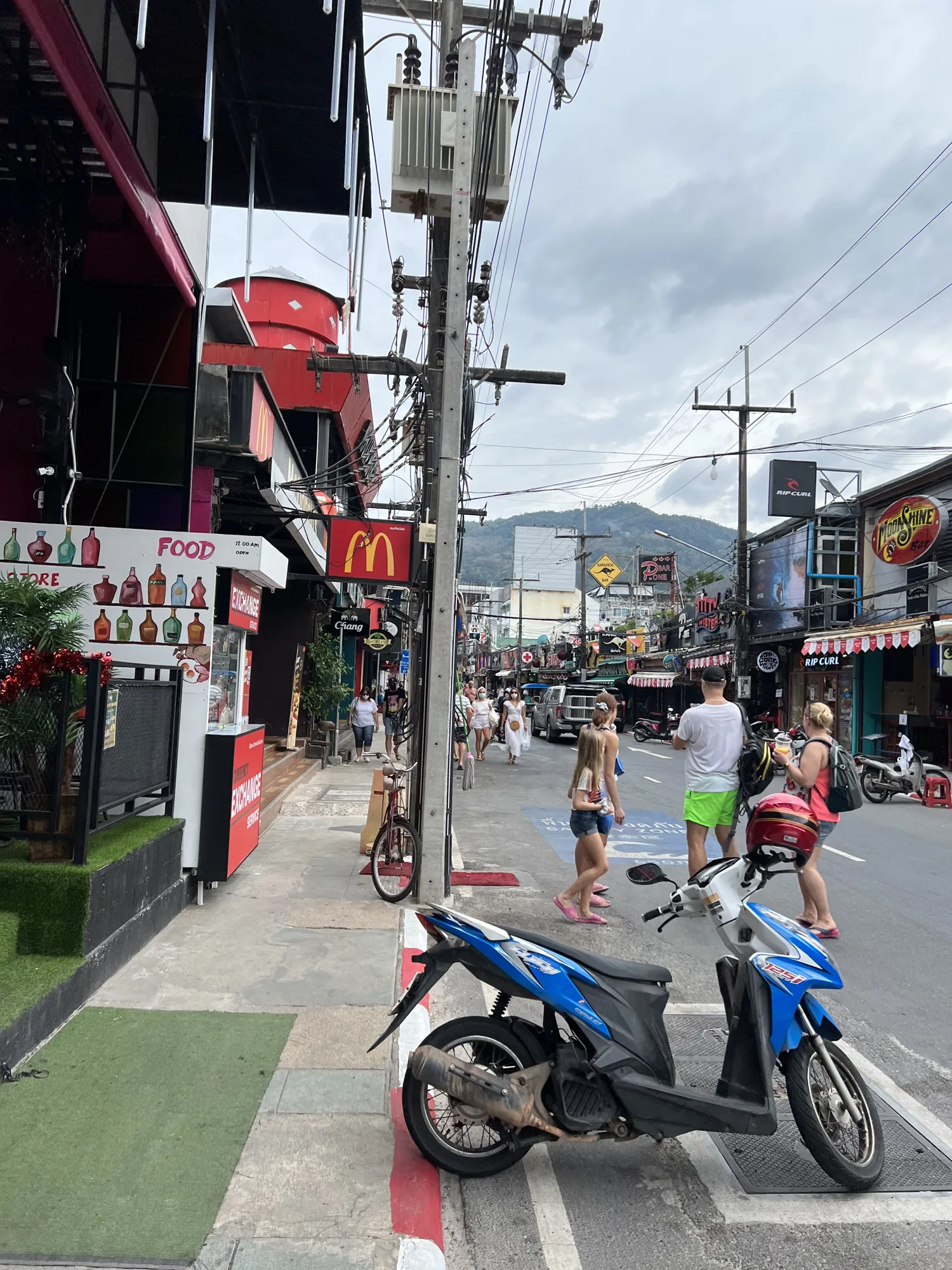 Street, scooters and overhead cables in Patong, Phuket