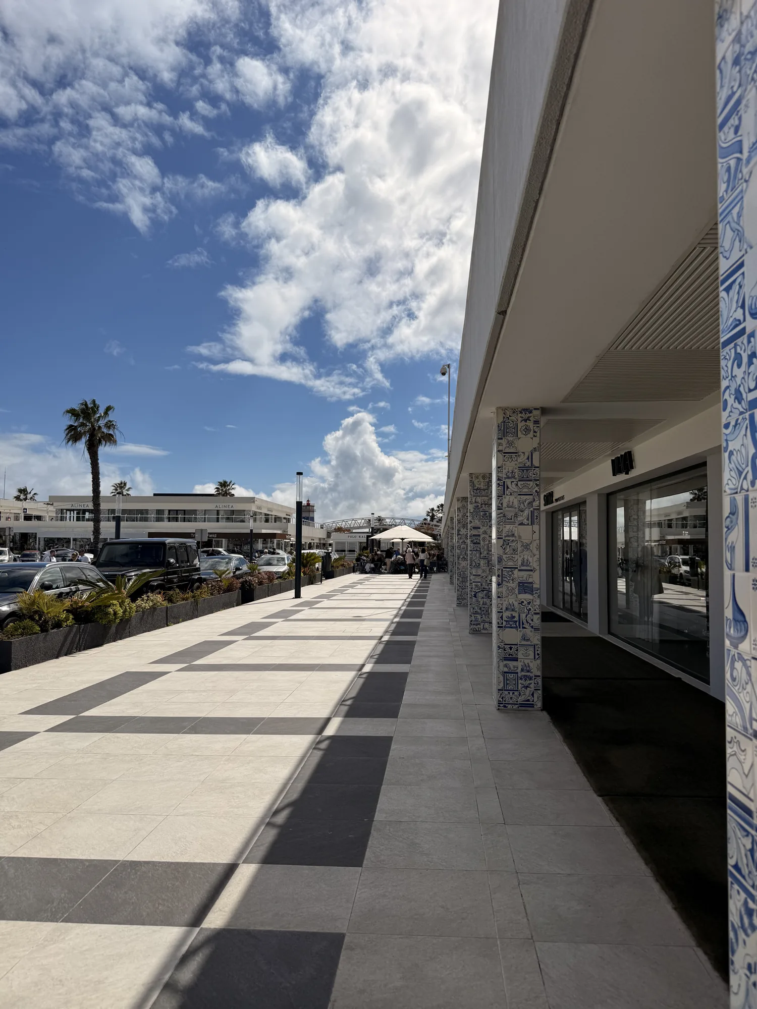 Broad paved walking space beside the marina area in Cascais