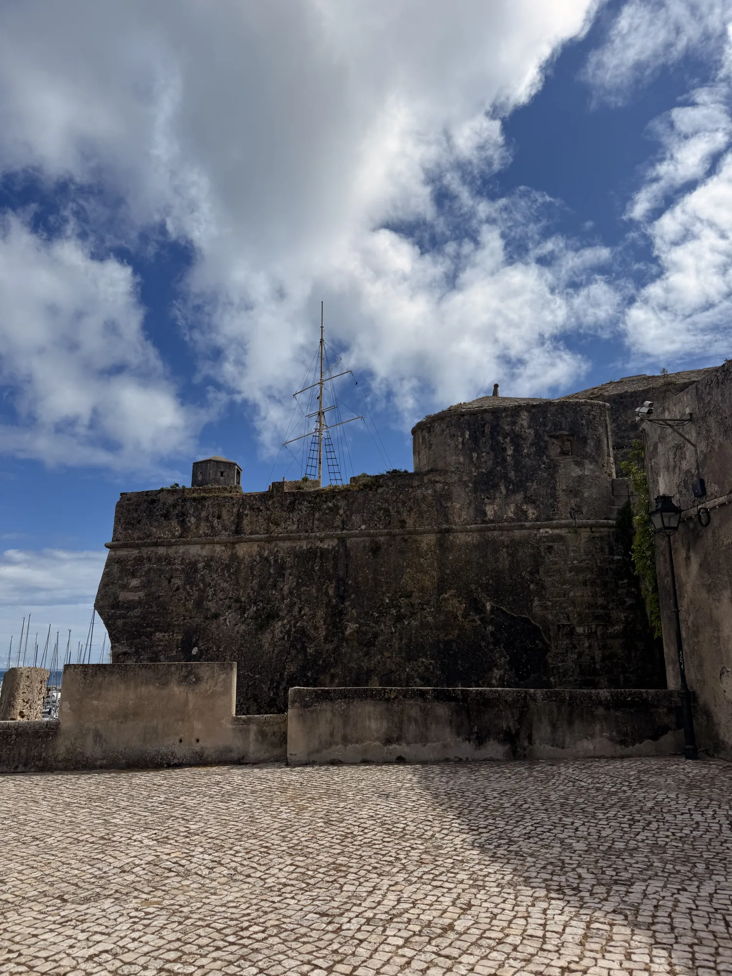 Stone fortress wall and paved forecourt in Cascais
