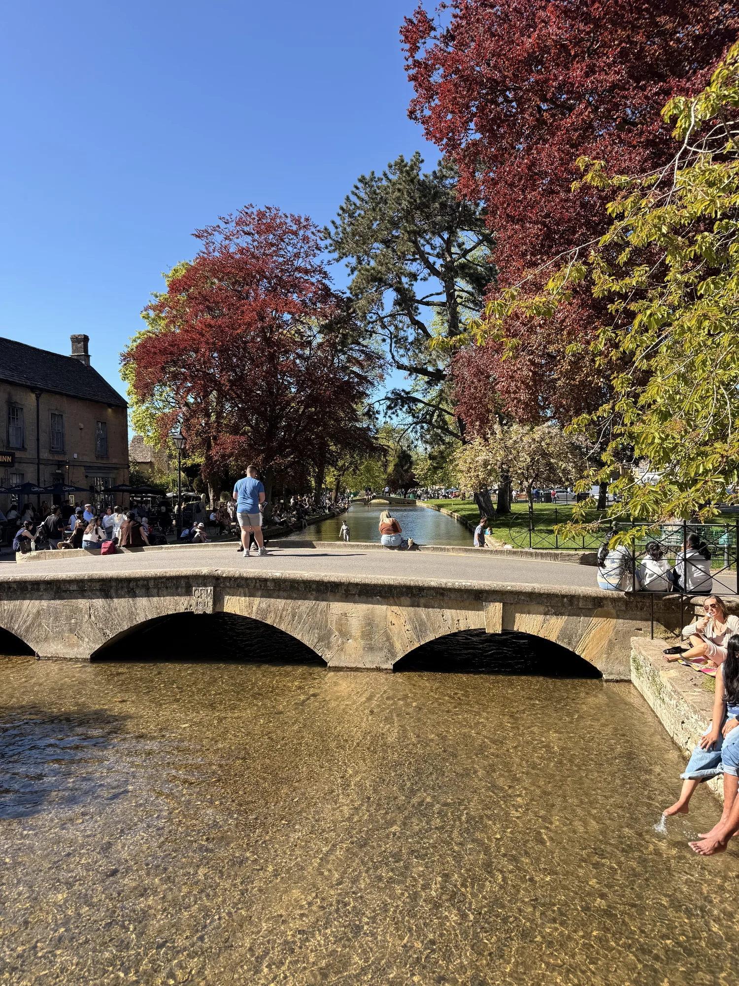 A low stone bridge across the Windrush at Bourton-on-the-Water.