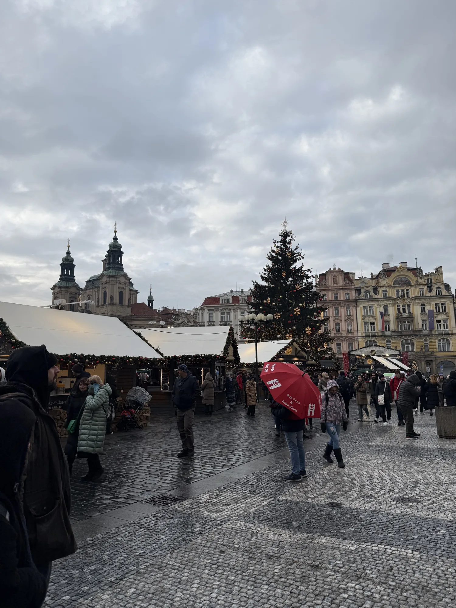 Seasonal stalls and people in Prague Old Town Square