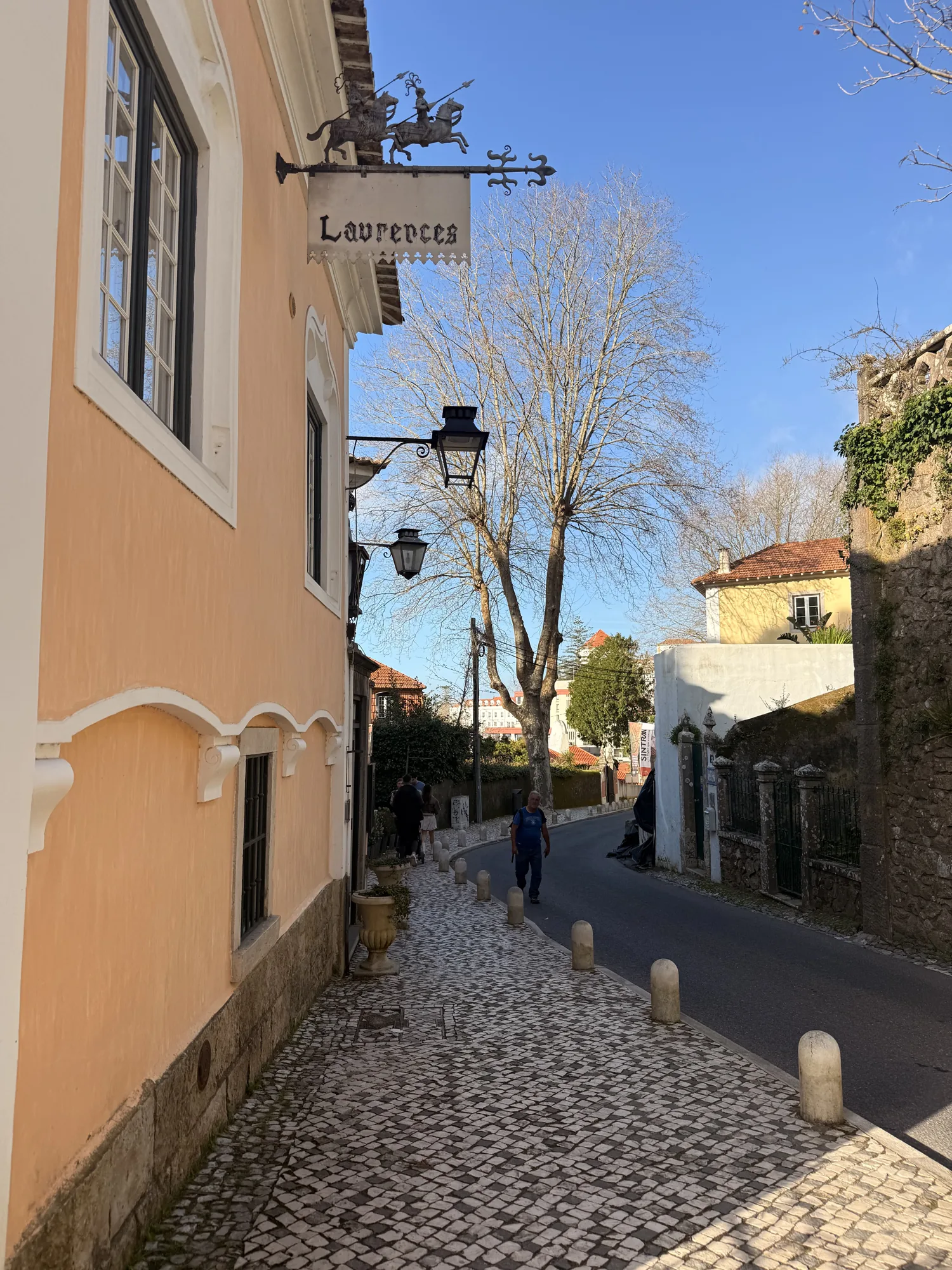 Narrow Sintra lane between yellow and pale buildings